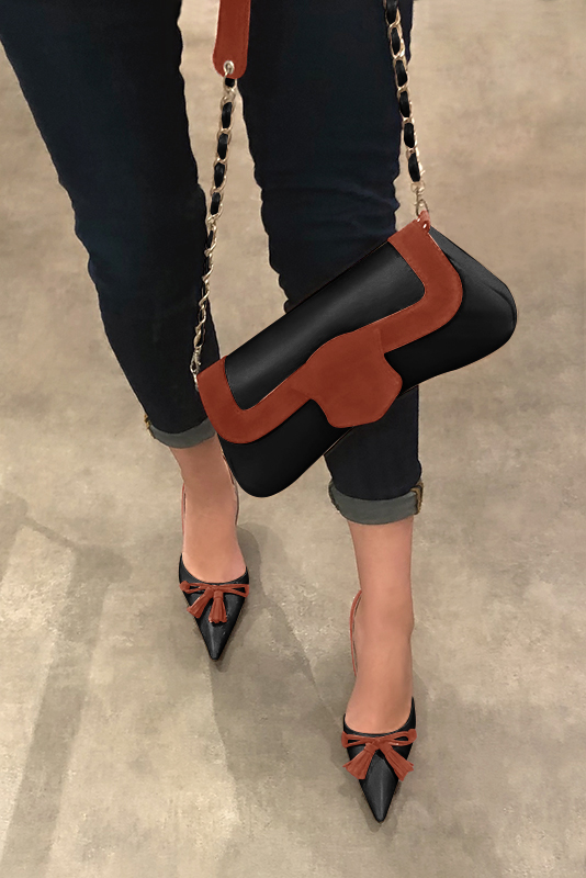Satin black and terracotta orange women's open arch dress pumps. Pointed toe. High slim heel. Worn view - Florence KOOIJMAN